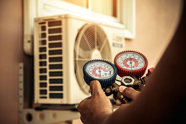 Professional Air Conditioning Service technician working in Iberia, OH
